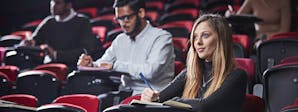 Event, Venue and Experience Management BA (Hons) Course Image 1200x450 - Woman sat in a theatre style classroom