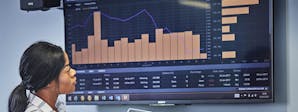 Finance and Investment Course Image 1200x450 - Woman looking at financial data